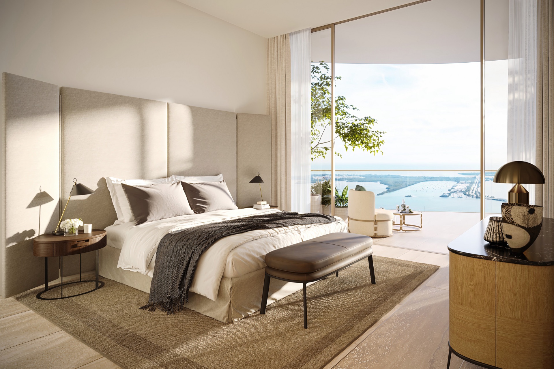 Primary bedroom with floor-to-ceiling panoramic windows facing Biscayne Bay.