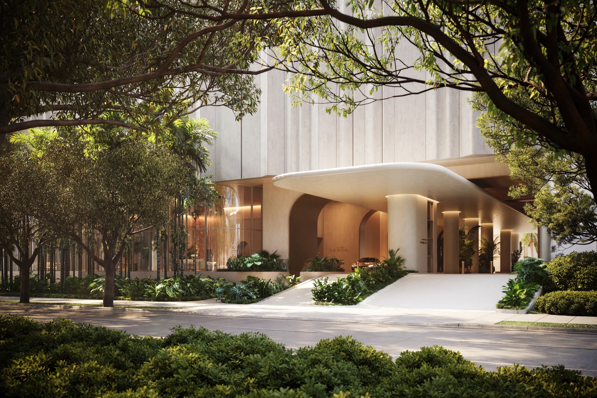 The Residences at 1428 Brickell — arrival at night, porte-cochère and lobby.