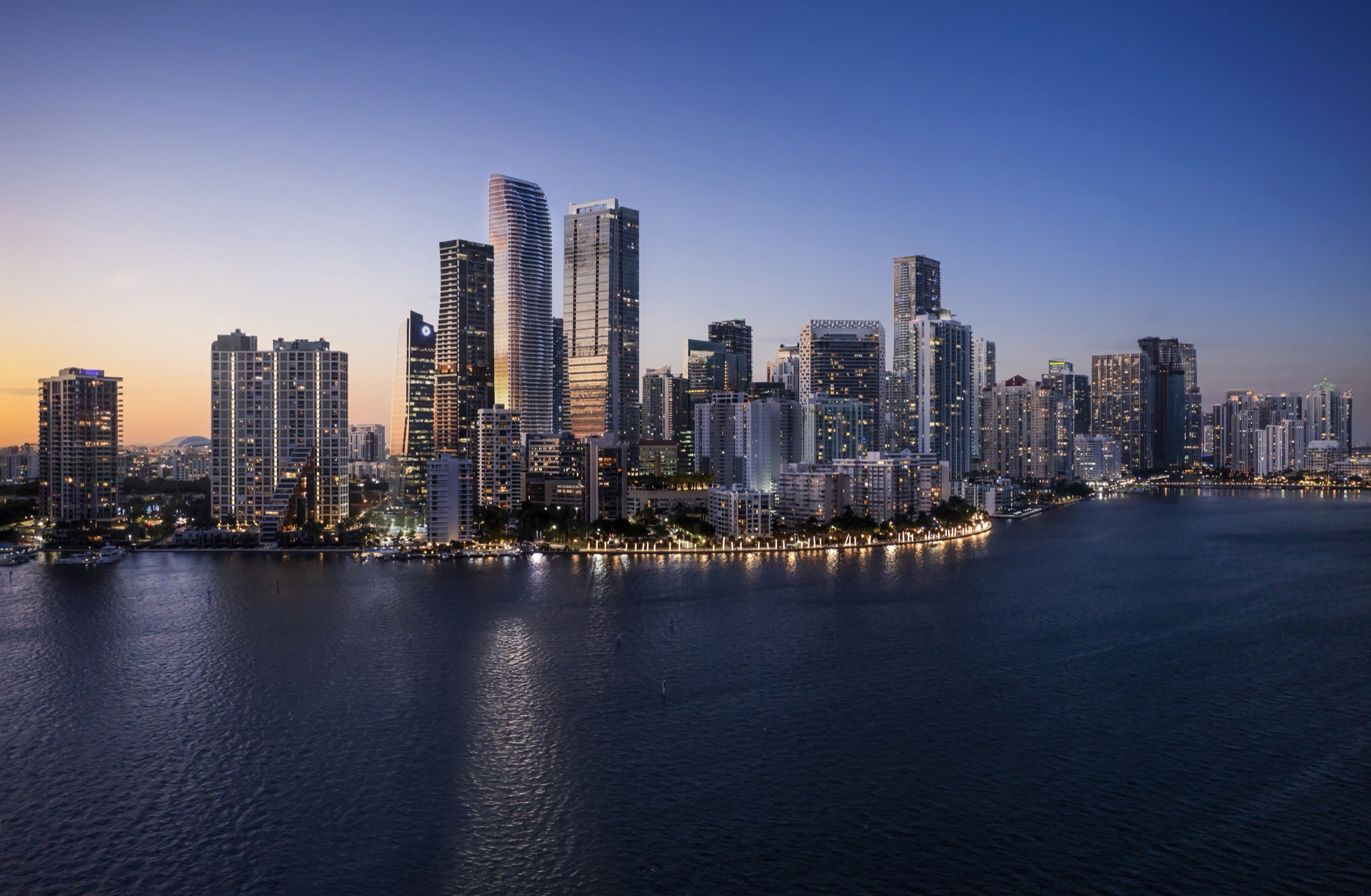 The Residences at 1428 Brickell — bayfront tower at dusk, viewed from Biscayne Bay.